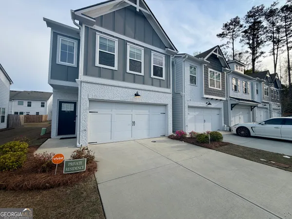 a couple of cars parked in front of a building