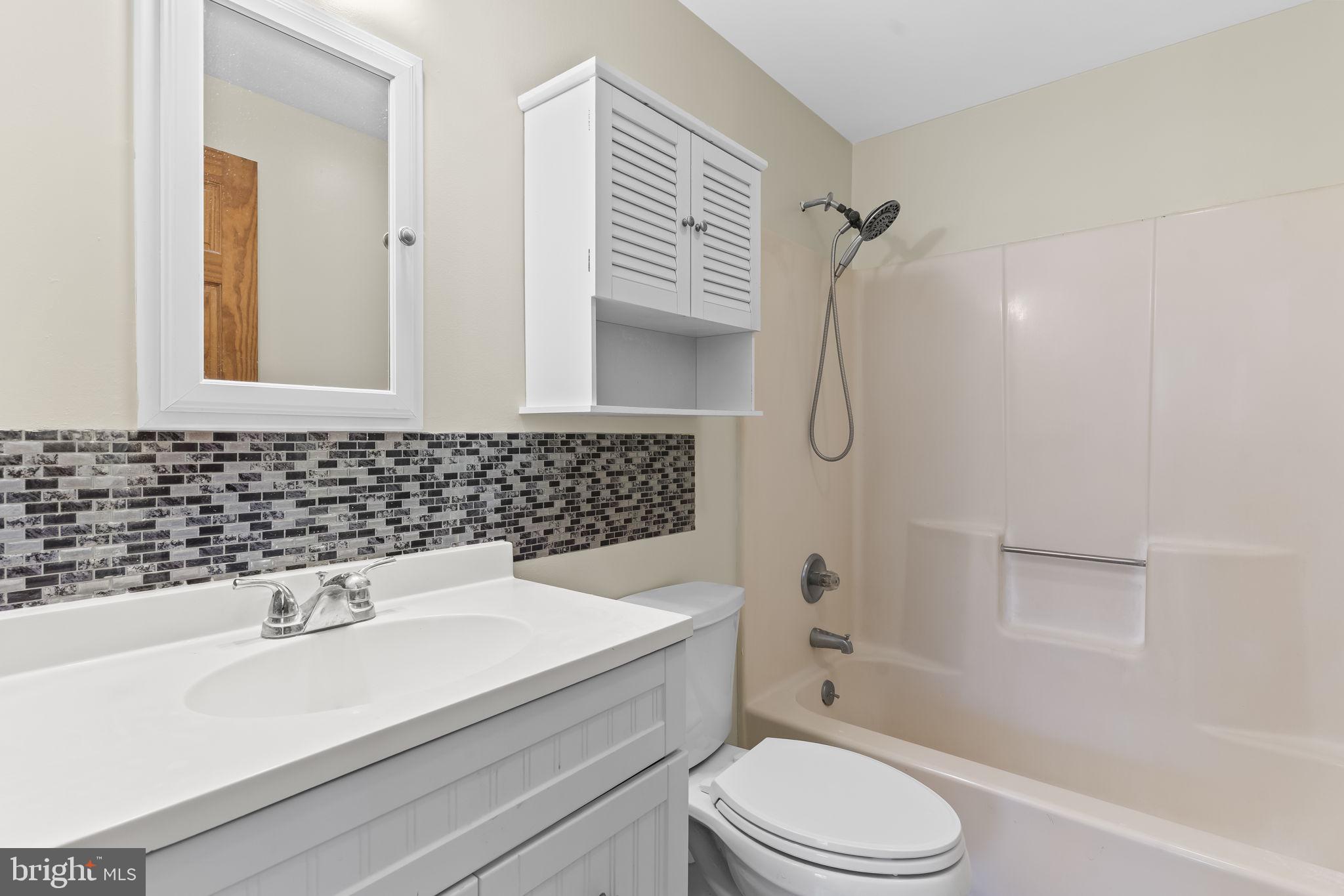 532 Shortbow Trail Lusby, MD 20657 - Photo 17 of 33 a bathroom with a sink toilet and shower