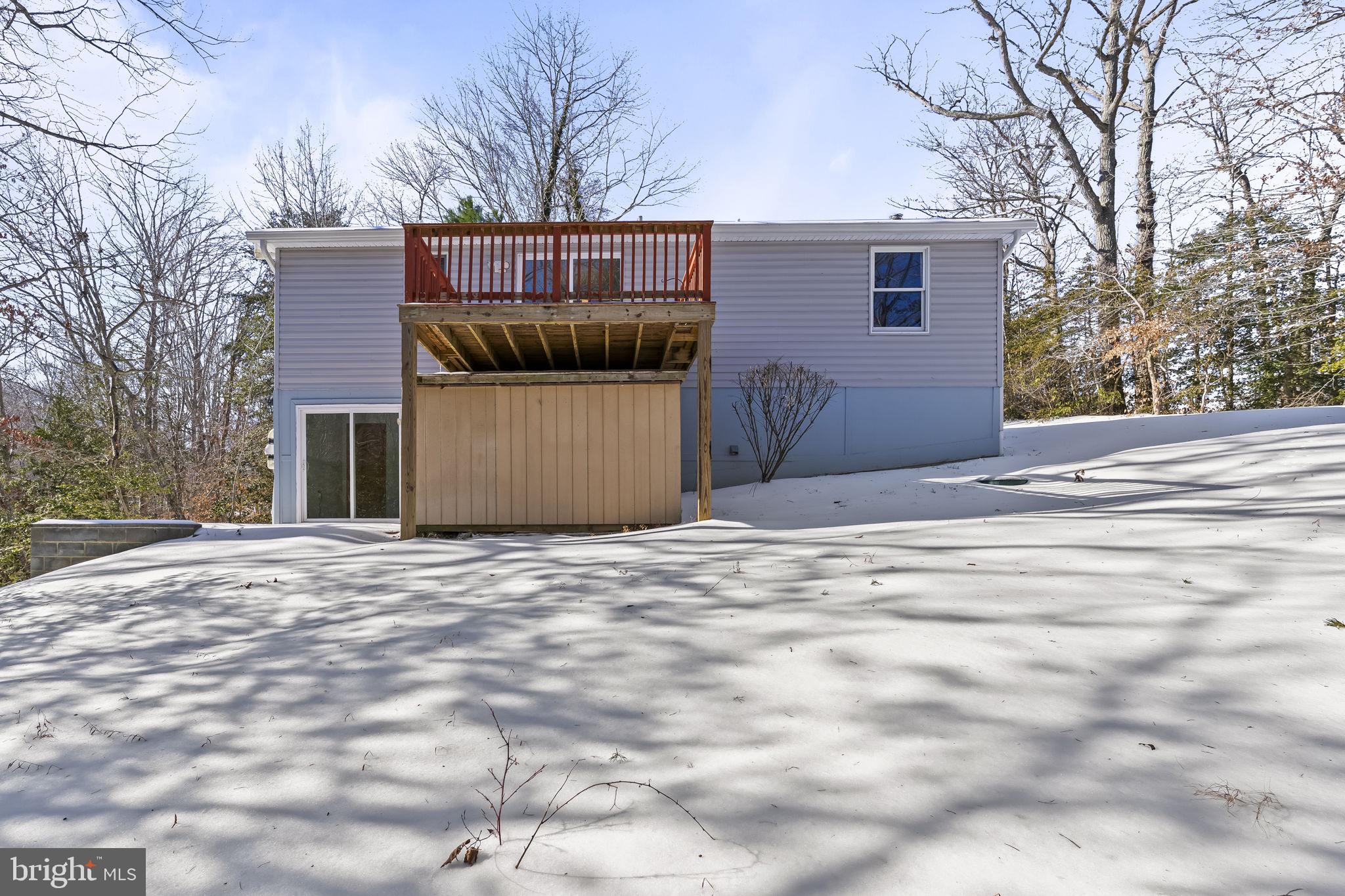 532 Shortbow Trail Lusby, MD 20657 - Photo 31 of 33 a front view of a house with a yard and garage