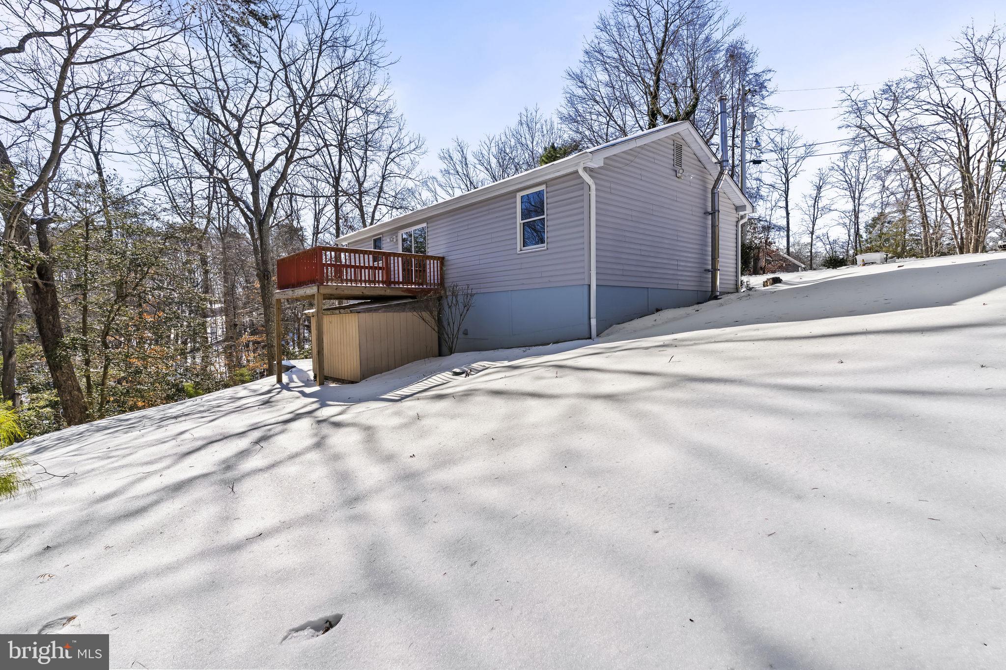 532 Shortbow Trail Lusby, MD 20657 - Photo 32 of 33 a backyard of a house with large trees