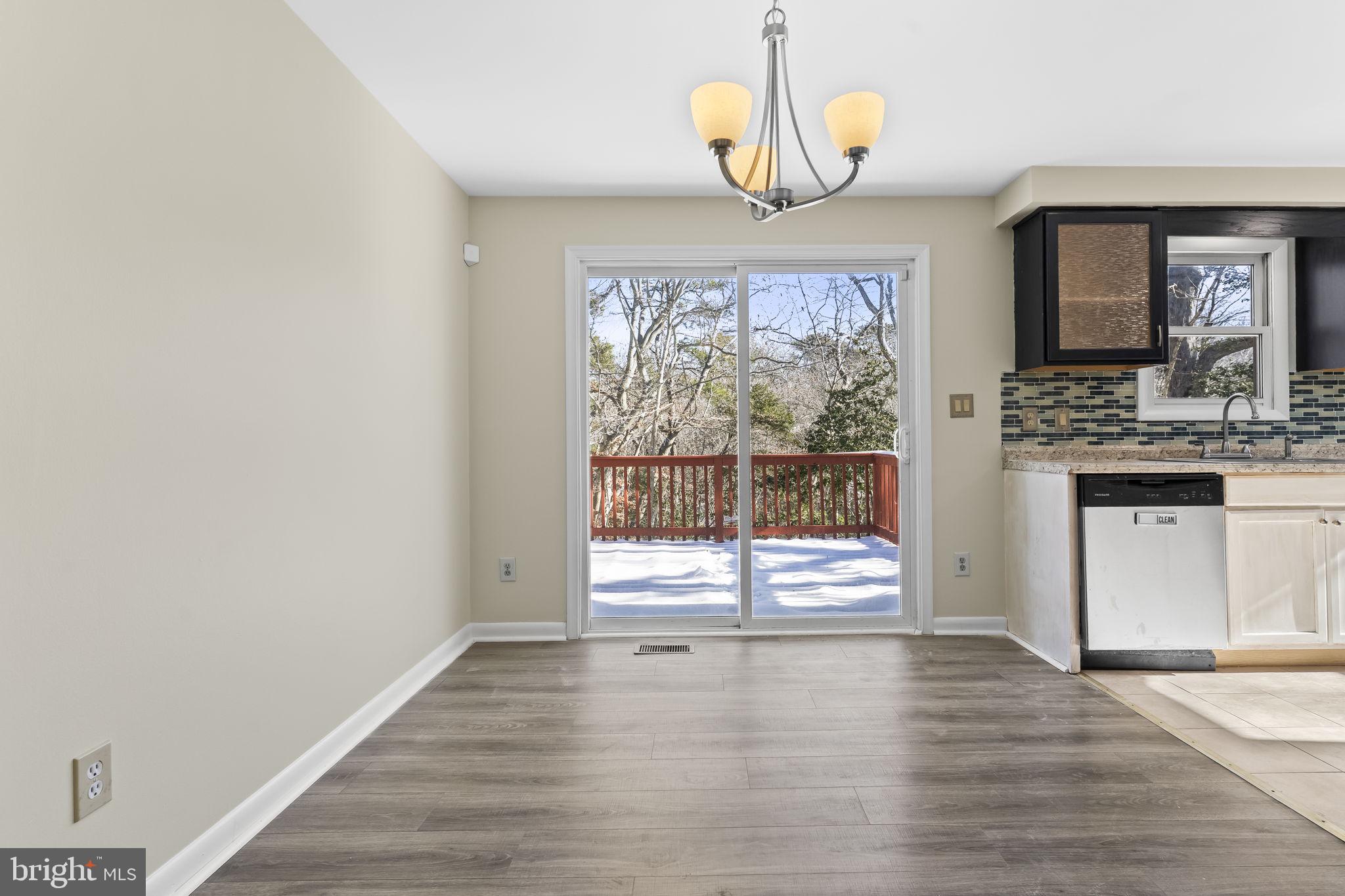 532 Shortbow Trail Lusby, MD 20657 - Photo 7 of 33 a view of an empty room with wooden floor and a window