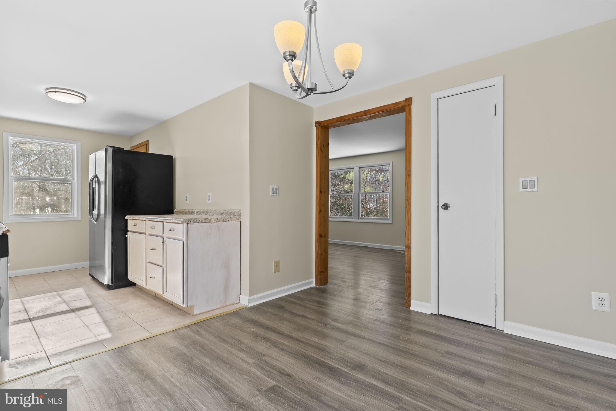 532 Shortbow Trail Lusby, MD 20657 - Photo 8 of 33 a view of a kitchen from the hallway