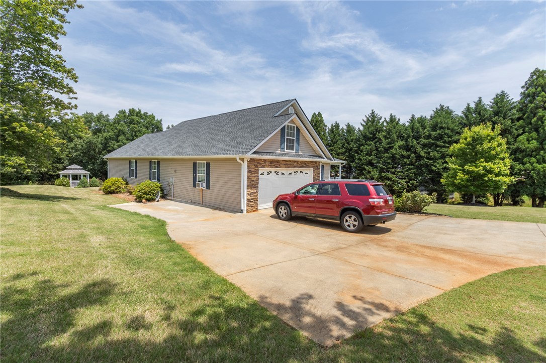 861 North Old Pendleton Road Liberty, SC 29657 - Photo 45 of 45 A welcoming home with a paved driveway and an enchanting gazebo in the verdant yard.