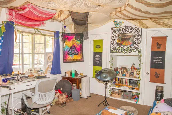 a living room filled with furniture and a table