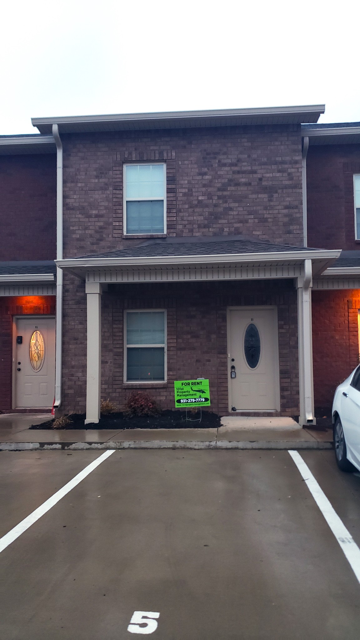 a front view of a house with garage