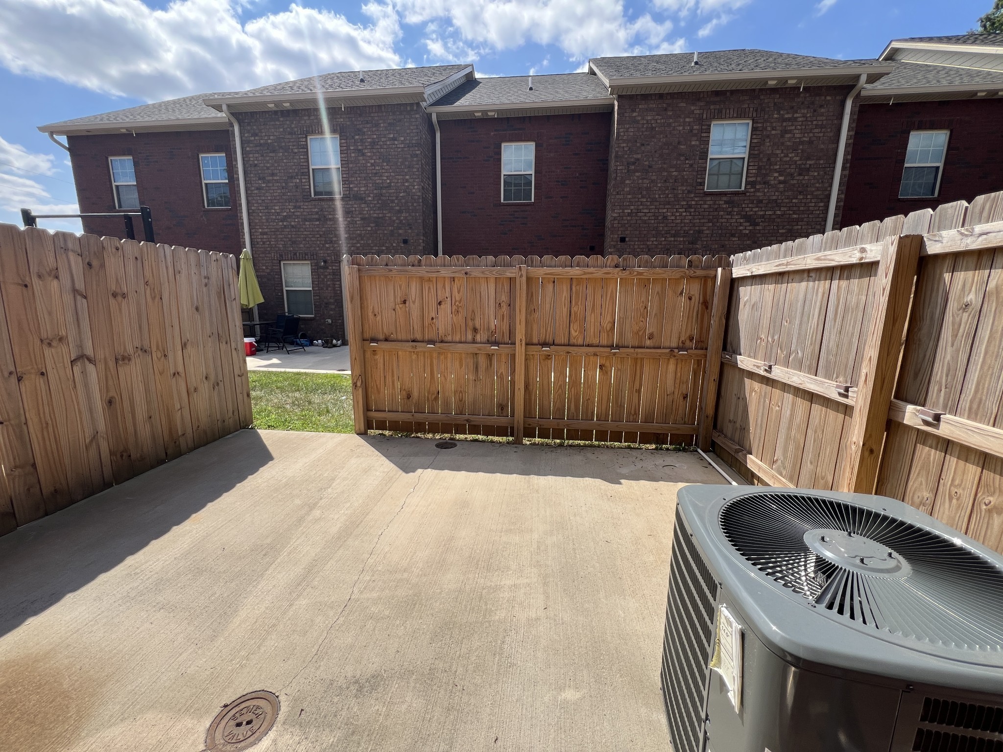 550 Peachers Mill Road, Unit B5 Clarksville, TN 37042 - Photo 28 of 33 a backyard of a house with barbeque oven and wooden fence