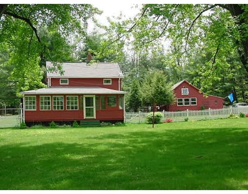 128 Ryan Road Northampton, MA 01062 - Photo 1 of 1 a view of a house with a big yard potted plants and large trees