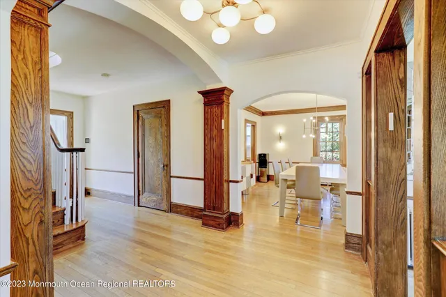 a view of a living room with furniture and floor to ceiling windows