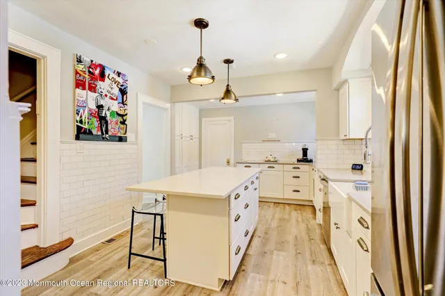 a very nice looking room with a big kitchen