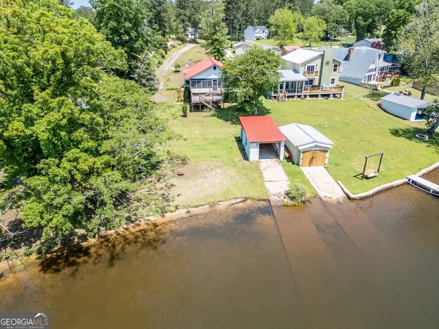 a view of a lake with houses in the back
