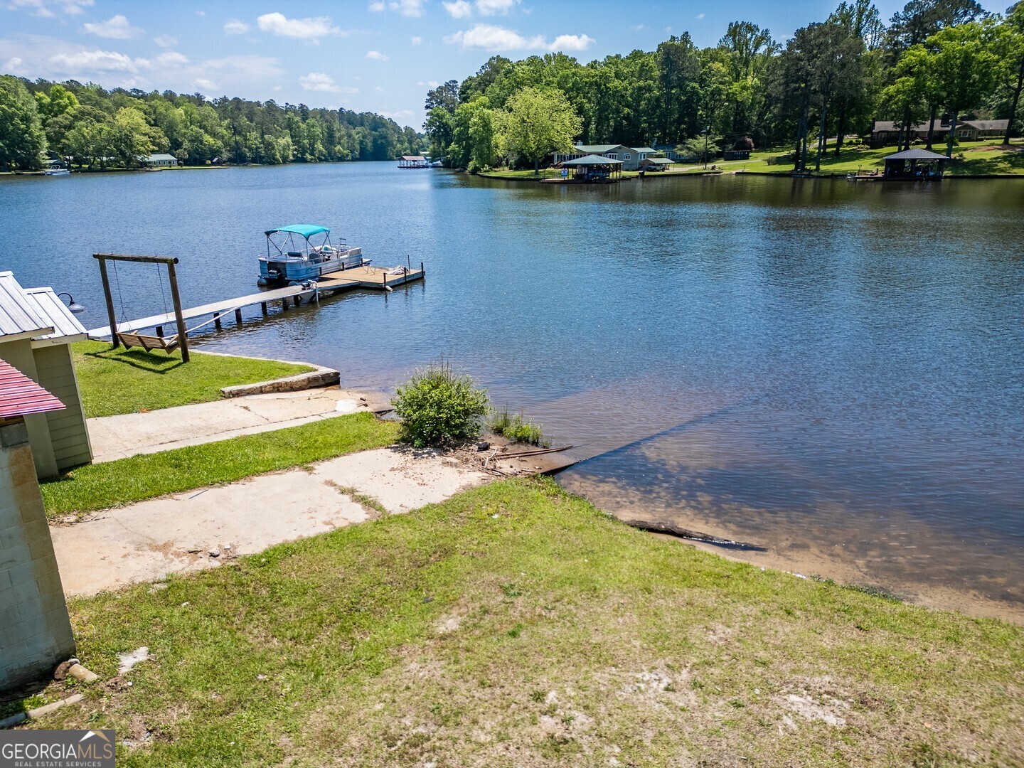 114 Mabry Road Jackson, GA 30233 - Photo 18 of 57 a view of a lake with houses in the back