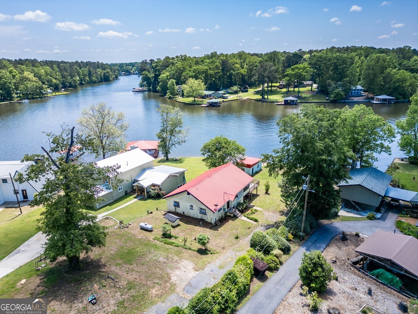 114 Mabry Road Jackson, GA 30233 - Photo 2 of 57 an aerial view of a house with a garden and lake view