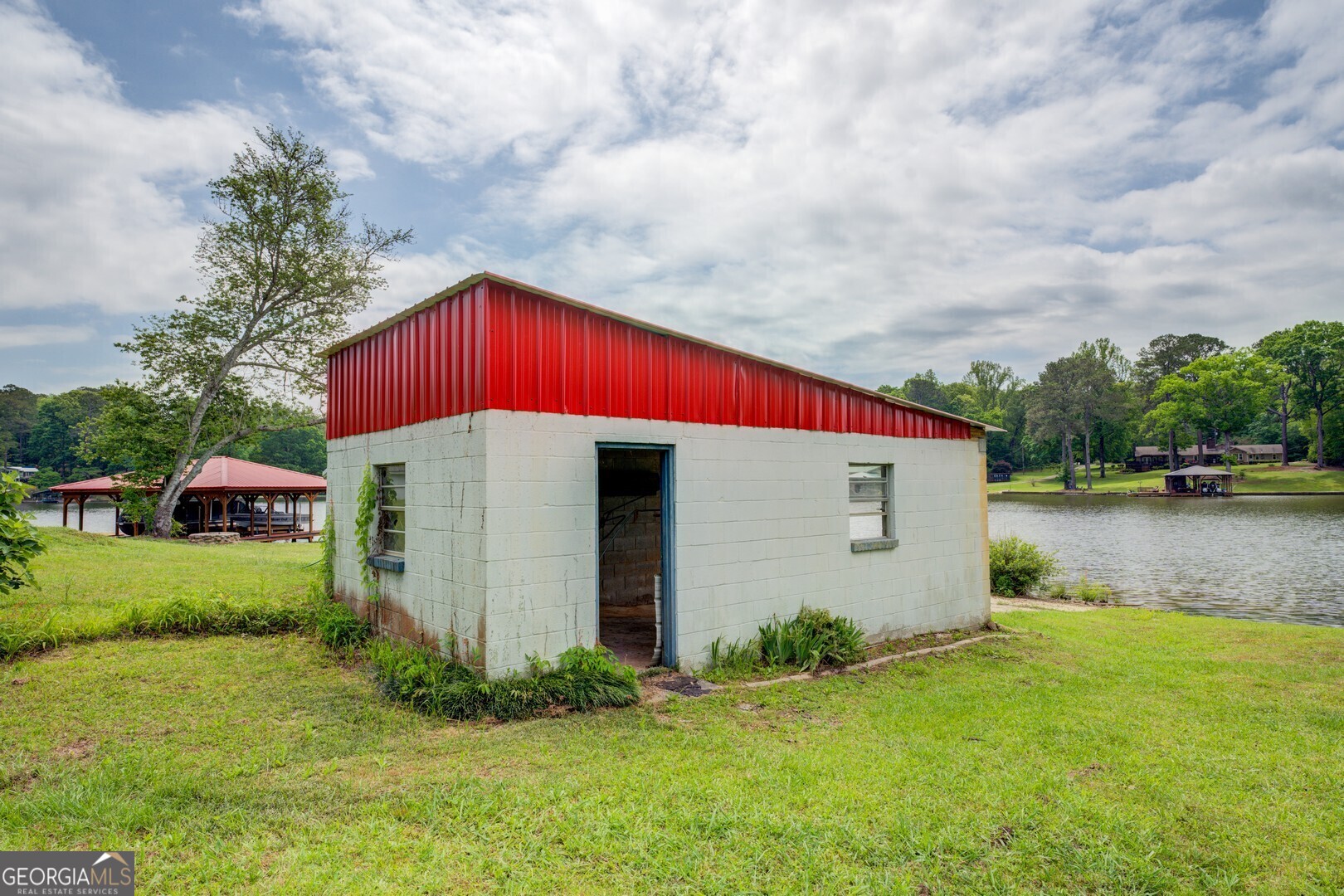 114 Mabry Road Jackson, GA 30233 - Photo 22 of 57 a view of backyard of house and car parked