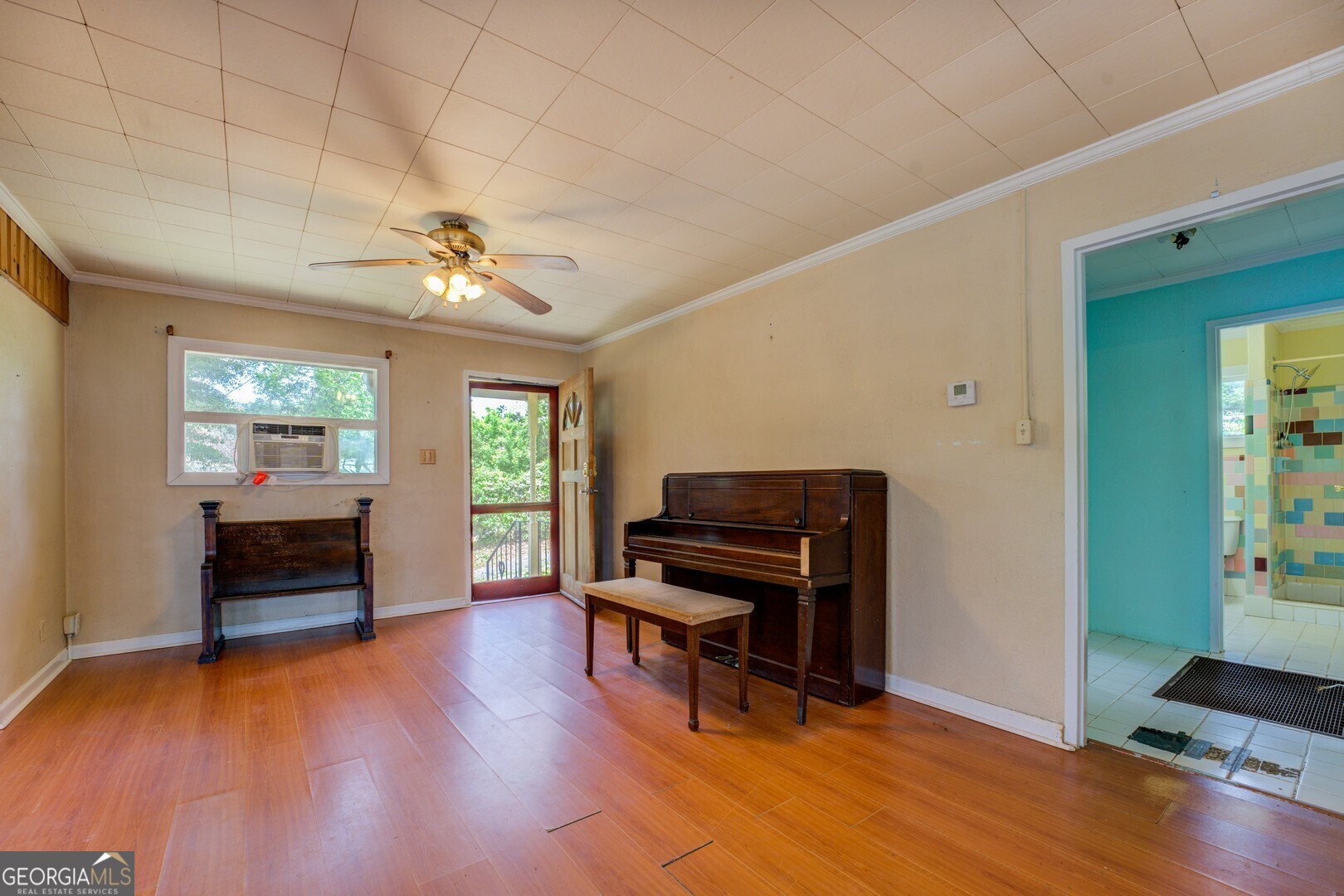 114 Mabry Road Jackson, GA 30233 - Photo 31 of 57 a living room with furniture and a piano