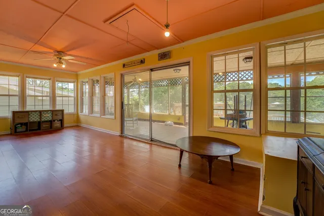 a view of livingroom with furniture wooden floor and chandelier