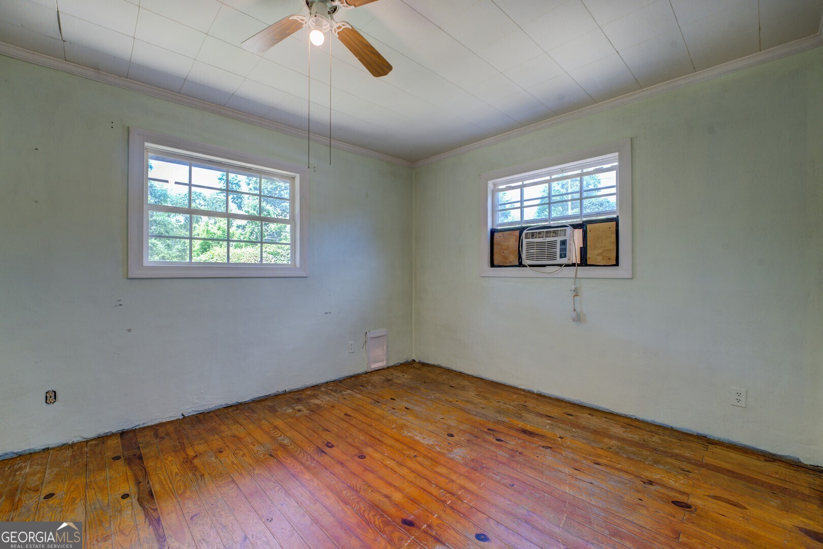 114 Mabry Road Jackson, GA 30233 - Photo 45 of 57 a view of empty room with wooden floor and fan