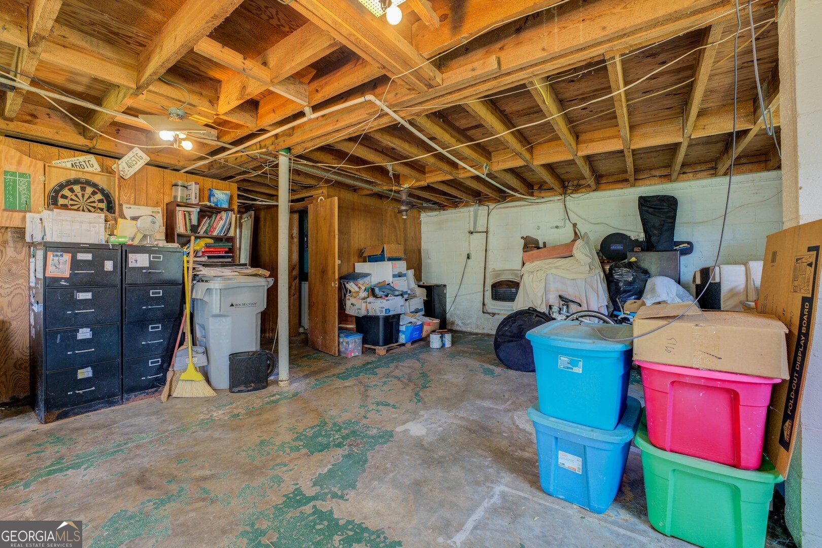 114 Mabry Road Jackson, GA 30233 - Photo 54 of 57 a view of a storage room with a refrigerator and storage