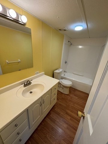 56 Dot's Lane Wareham, MA 02558 - Photo 15 of 28 a bathroom with a double vanity sink toilet and mirror