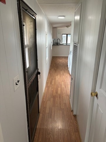 56 Dot's Lane Wareham, MA 02558 - Photo 19 of 28 a view of a hallway with wooden floor