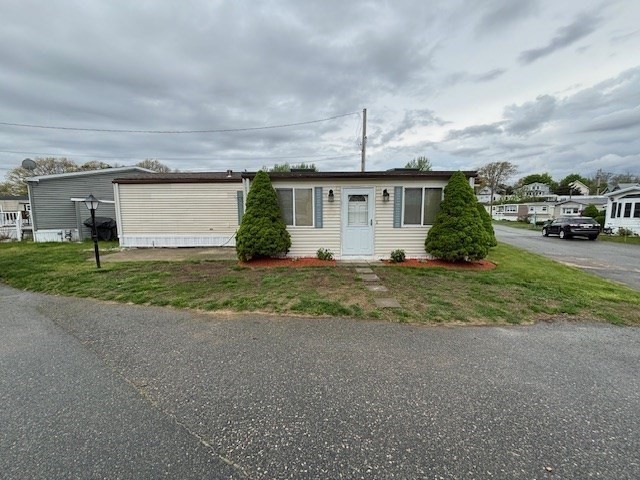 56 Dot's Lane Wareham, MA 02558 - Photo 2 of 28 a front view of house with yard and green space
