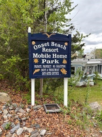 56 Dot's Lane Wareham, MA 02558 - Photo 22 of 28 a view of a wooden house with a sign broad