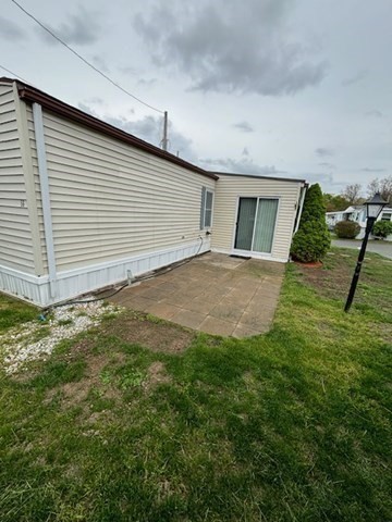 56 Dot's Lane Wareham, MA 02558 - Photo 4 of 28 a view of a backyard of the house