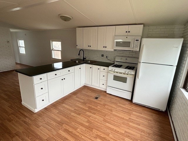56 Dot's Lane Wareham, MA 02558 - Photo 5 of 28 a kitchen with granite countertop white cabinets and white appliances