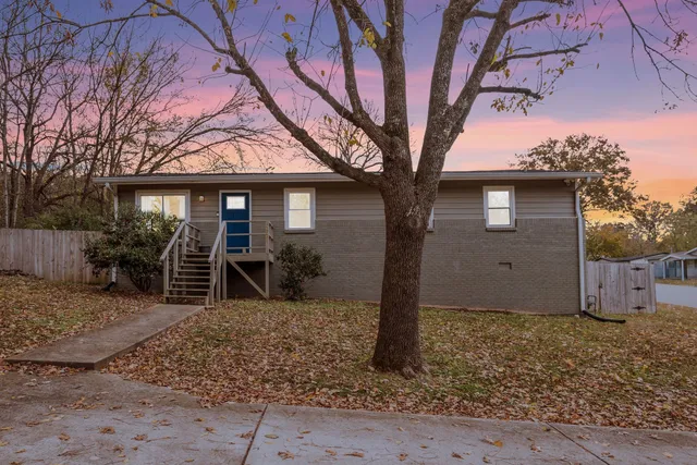 a front view of a house with garden