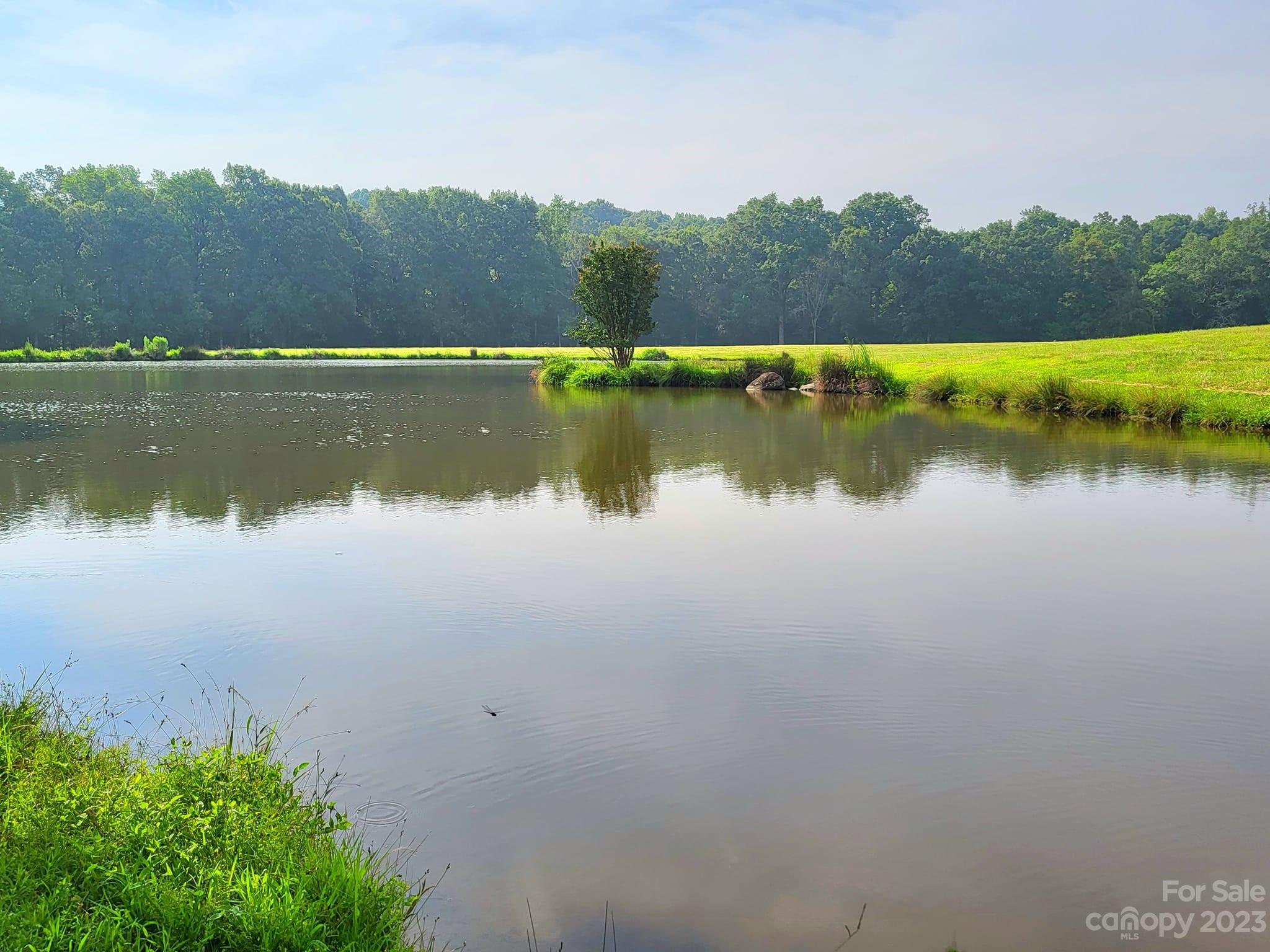 3613 Austin Road Monroe, NC 28112 - Photo 42 of 46 a view of a lake with a city view