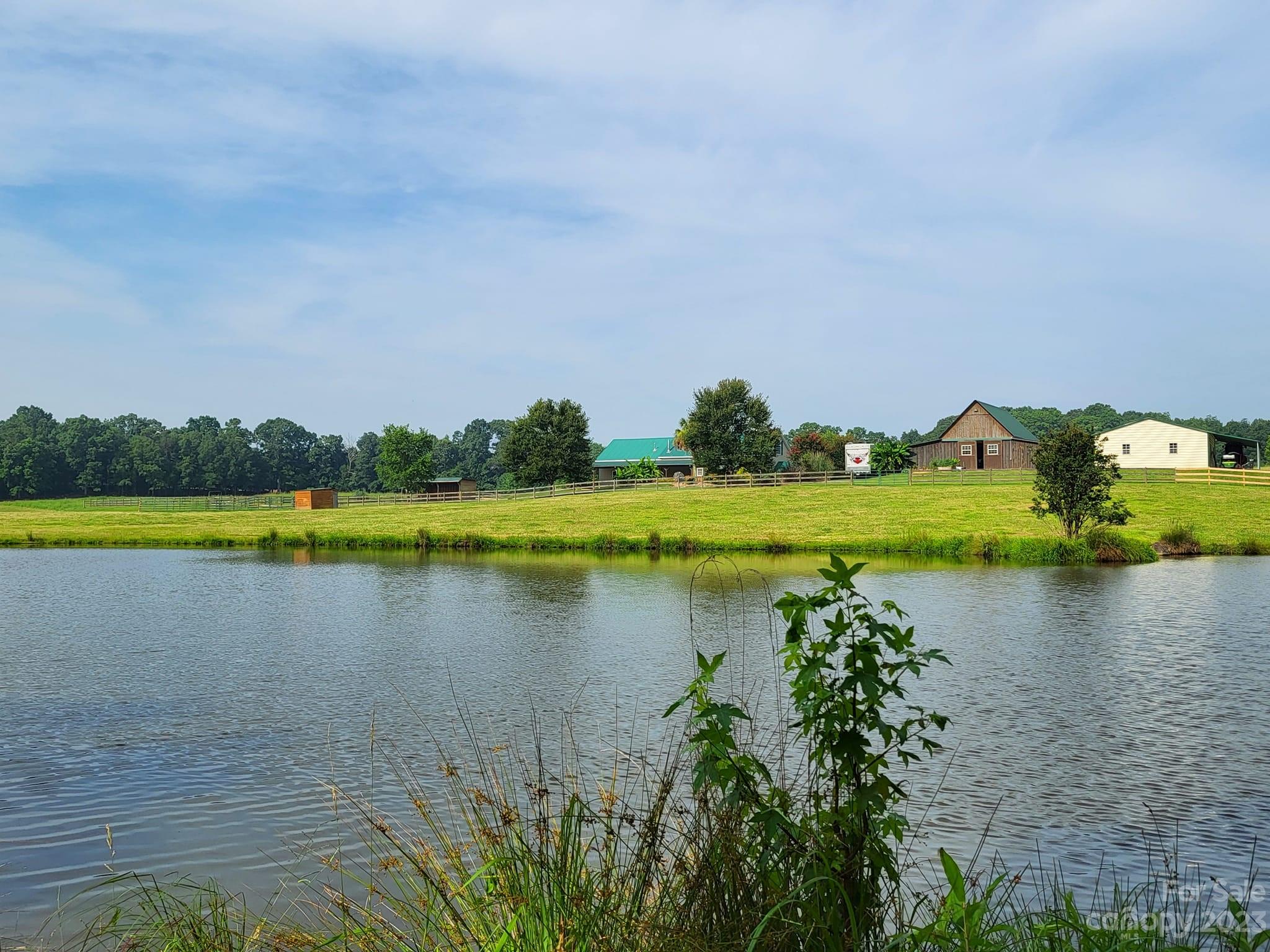 3613 Austin Road Monroe, NC 28112 - Photo 43 of 46 a view of a lake with houses in the back