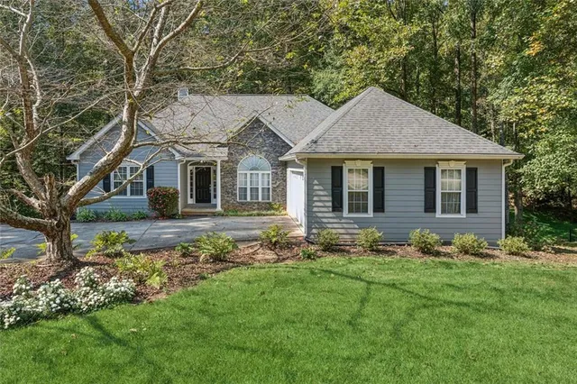 a front view of a house with garden