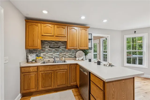a kitchen with a sink stove and cabinets