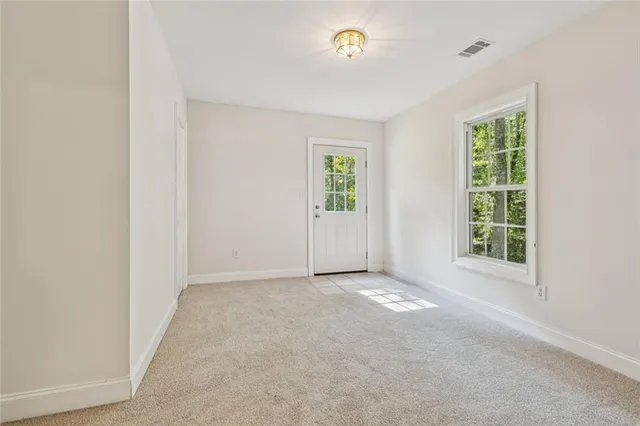 an empty room with windows