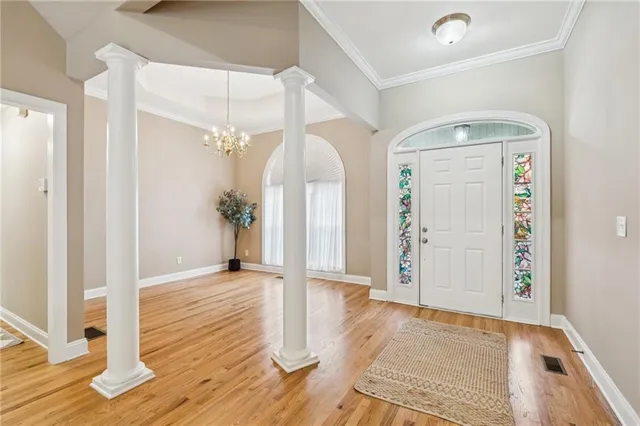 a view of a hallway view with wooden floor and staircase