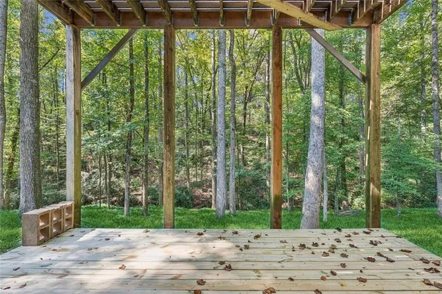 a view of a yard in front of a house with a garden