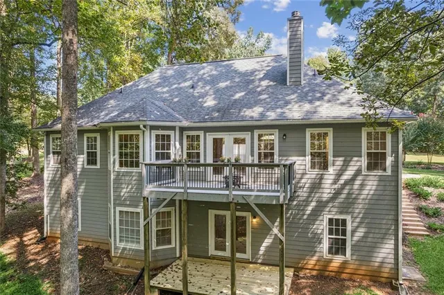 a house view with a sitting space and garden space