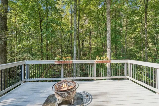 a view of balcony with wooden floor and outdoor seating
