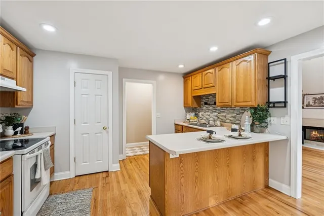 a spacious bathroom with a sink a mirror and a shower