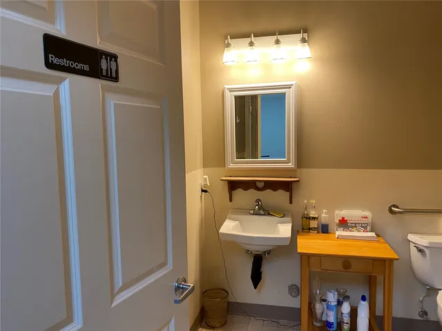 a bathroom with a sink and mirror