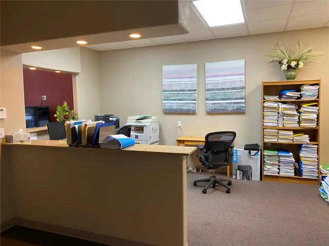 a work room with furniture and gym equipment