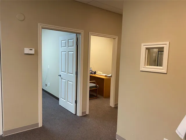 a view of a bathroom from the hallway