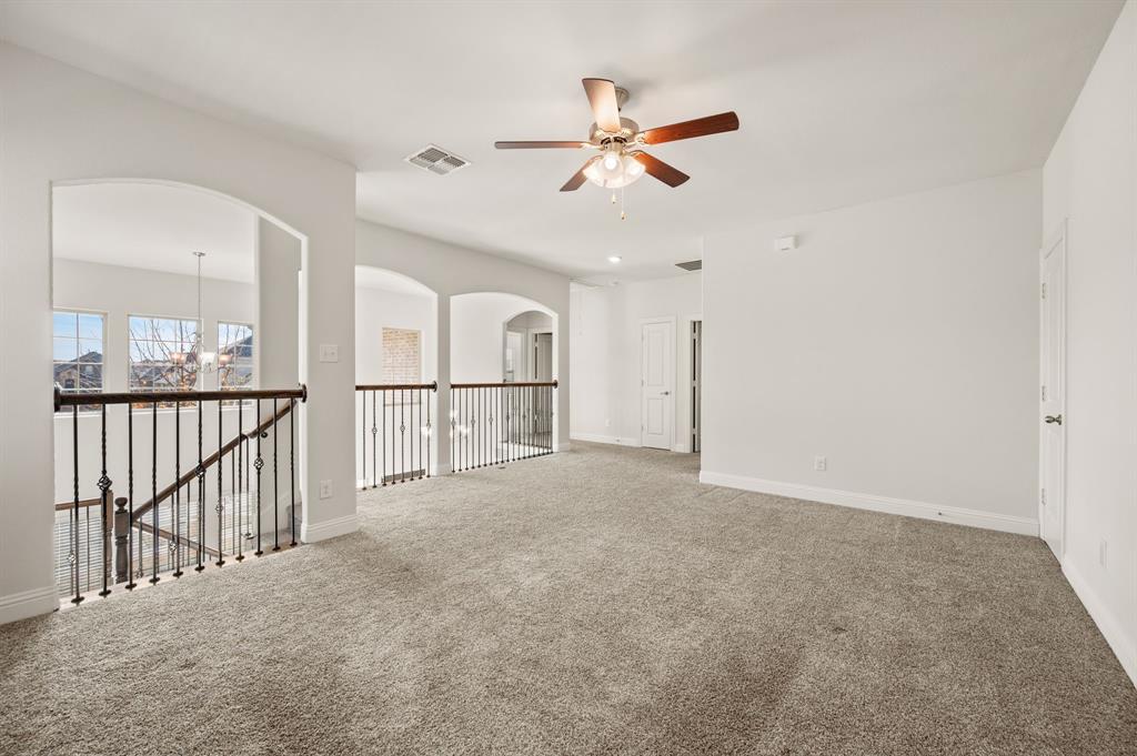 10920 Calvert Place McKinney, TX 75071 - Photo 21 of 37 a view of a hallway with a ceiling fan
