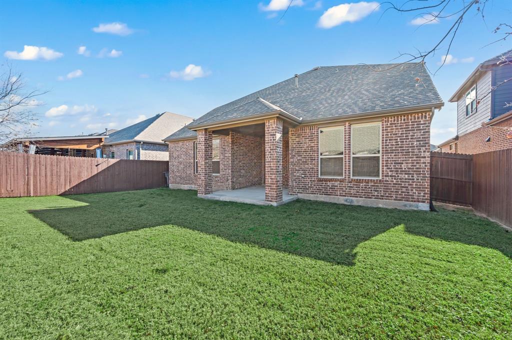 10920 Calvert Place McKinney, TX 75071 - Photo 27 of 37 a view of a yard in front of a house