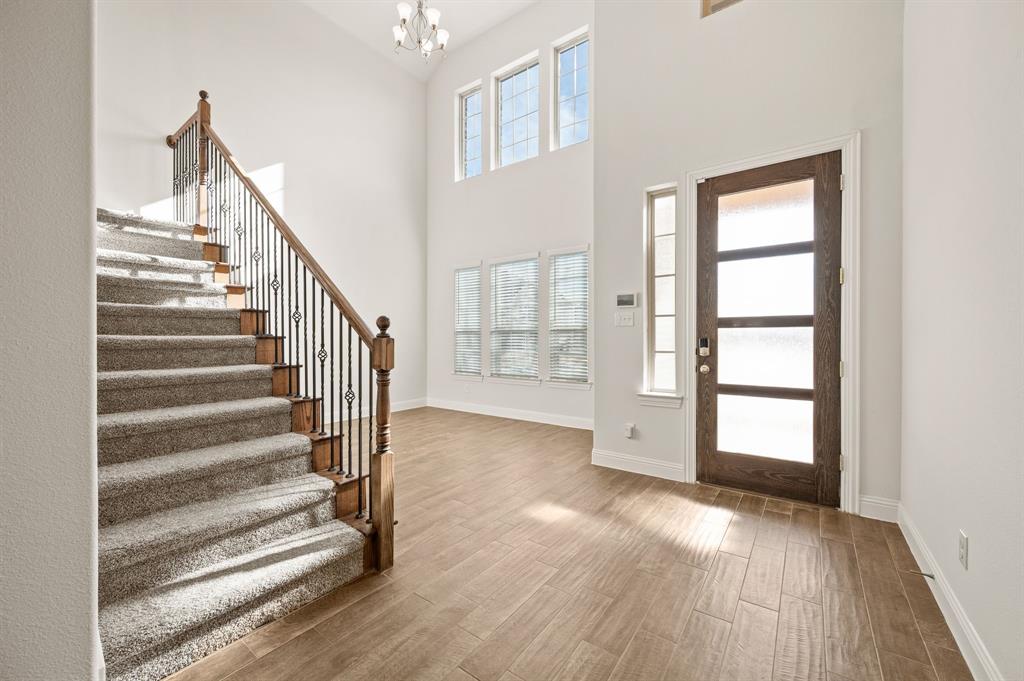 10920 Calvert Place McKinney, TX 75071 - Photo 3 of 37 a view of staircase with white walls and windows