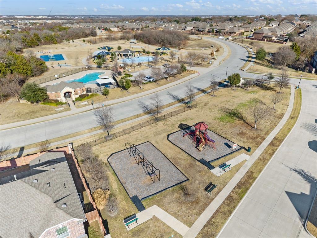 10920 Calvert Place McKinney, TX 75071 - Photo 33 of 37 an aerial view of residential houses with outdoor space