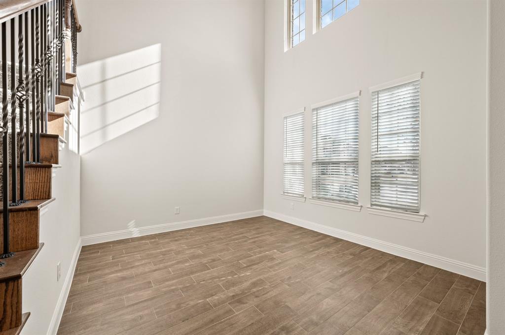 10920 Calvert Place McKinney, TX 75071 - Photo 4 of 37 a view of an empty room with a window