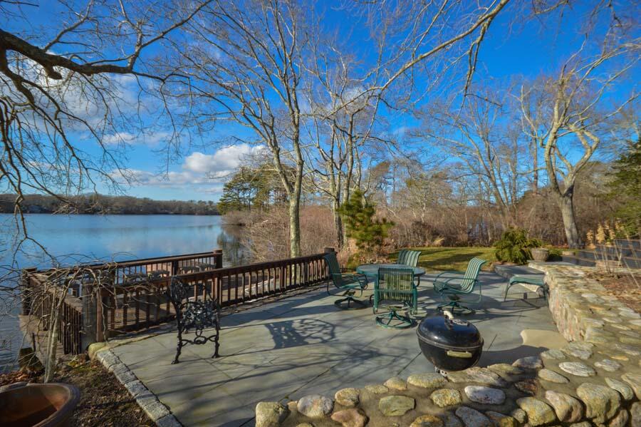 351 Huckins Neck Road Centerville, MA 02632 - Photo 18 of 55 a view of a terrace with chairs