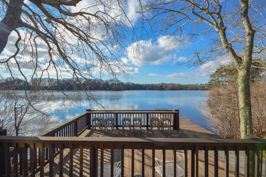 351 Huckins Neck Road Centerville, MA 02632 - Photo 19 of 55 a view of a lake from a balcony