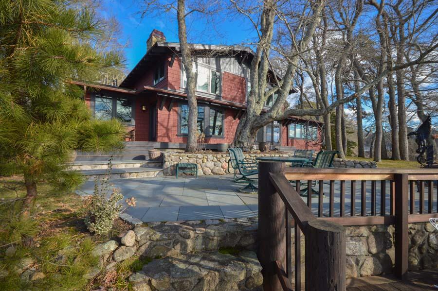 351 Huckins Neck Road Centerville, MA 02632 - Photo 20 of 55 a view of a brick house with large trees