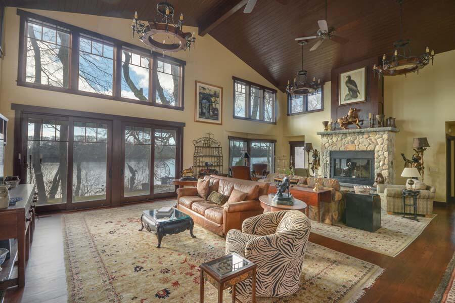 351 Huckins Neck Road Centerville, MA 02632 - Photo 29 of 55 a living room with fireplace furniture and a large window